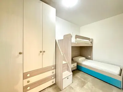 Letto o letti in una camera di Villaggio Lido - Carraro Immobiliare - Family Apartments