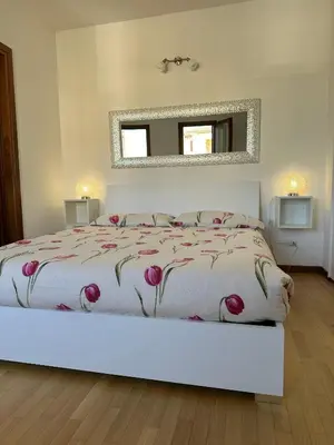 Letto o letti in una camera di Appartamento Marisa