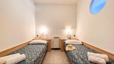Letto o letti in una camera di Il Giardino delle farfalle by Ca-Sa Check