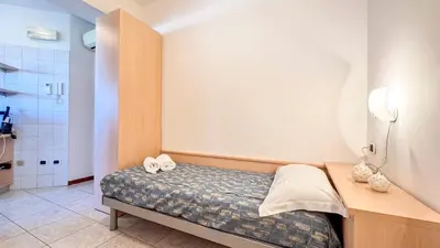 Letto o letti in una camera di Il Giardino delle farfalle by Ca-Sa Check