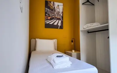 Letto o letti in una camera di Welc-ōM Near Sant'Antonio Free Parking