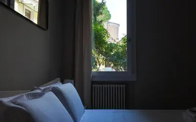 Letto o letti in una camera di Welc-ōM Near Sant'Antonio Free Parking