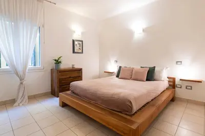 Letto o letti in una camera di enJoy Home - Appartamento Carducci