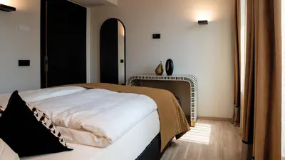 Letto o letti in una camera di Relais Santa Lucia - Appartamenti Superior e Deluxe