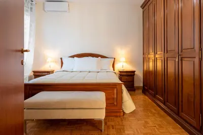 Letto o letti in una camera di Domus Tiliae