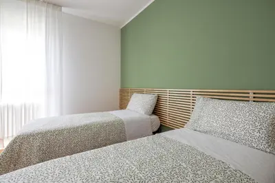 Letto o letti in una camera di Casa Genny