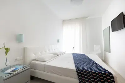 Letto o letti in una camera di Hotel Cavallino Bianco