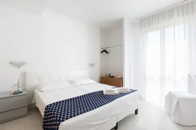 Letto o letti in una camera di Hotel Cavallino Bianco