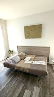 Letto o letti in una camera di Mazzini Green Suites Jesolo