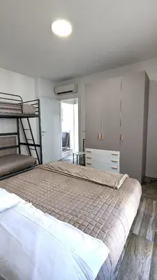 Letto o letti in una camera di Mazzini Green Suites Jesolo