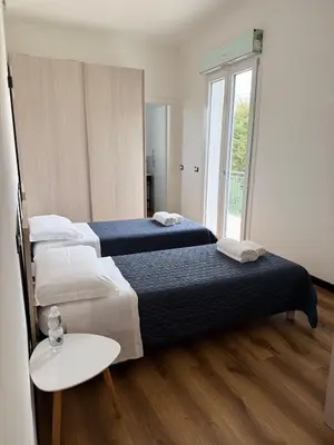 Letto o letti in una camera di Infinity House - Eleganza Moderna tra Treviso e Venezia