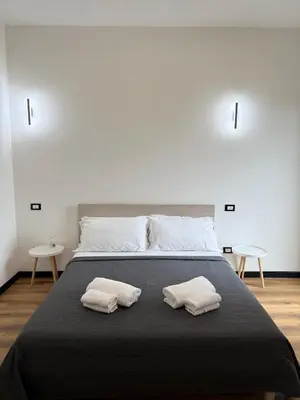 Letto o letti in una camera di Infinity House - Eleganza Moderna tra Treviso e Venezia