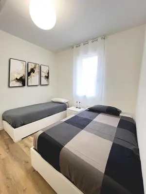 Letto o letti in una camera di Casa Umberto