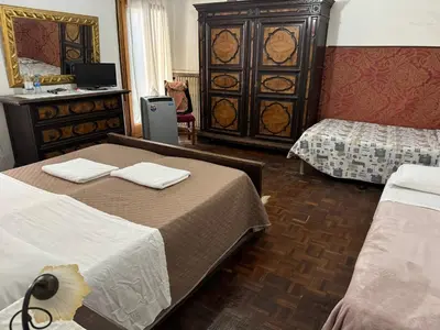 Letto o letti in una camera di Residence Fortuny Princessclass