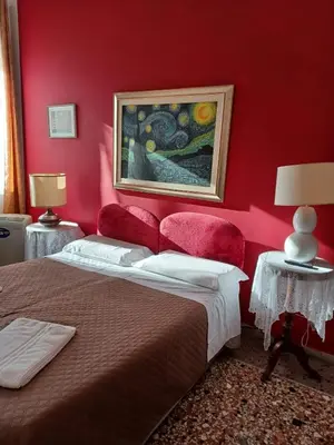 Letto o letti in una camera di Residence Fortuny Princessclass