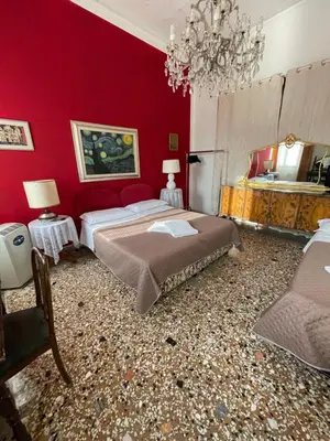 Letto o letti in una camera di Residence Fortuny Princessclass