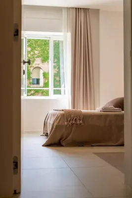 Letto o letti in una camera di Santa Lucia Suites
