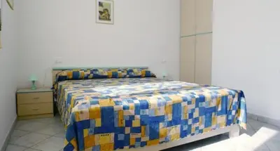 Letto o letti in una camera di Comfy flat in Rosolina with shared pool