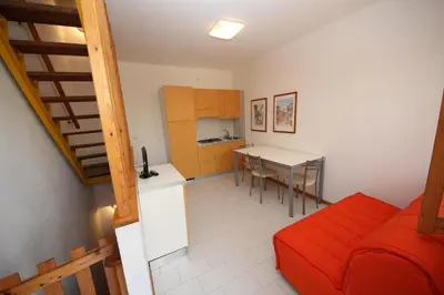 Cucina o angolo cottura di Enjoy our flat with garden in Rosolina