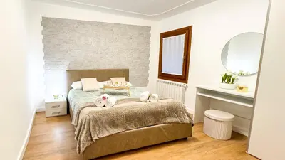 Letto o letti in una camera di C a.l.i. by Ca-Sa Check