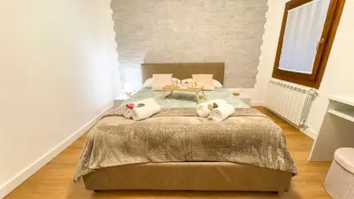 Letto o letti in una camera di C a.l.i. by Ca-Sa Check