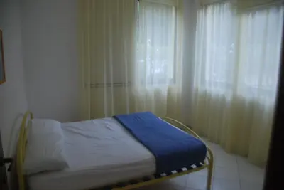 Letto o letti in una camera di Rosolina cozy flat wth pool