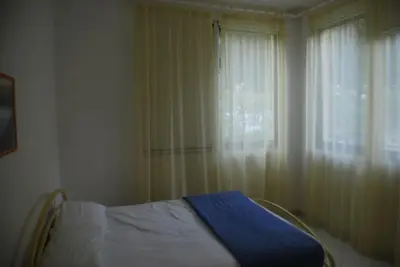 Letto o letti in una camera di Rosolina cozy flat wth pool