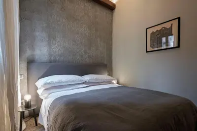 Letto o letti in una camera di Cá delle Capriate, an intimate retreat at Cà d'Oro