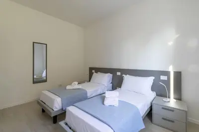 Letto o letti in una camera di Ca' Milla 1 by WelcHome