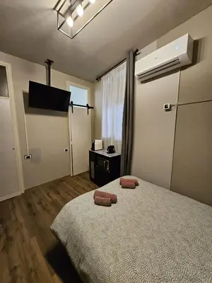 Letto o letti in una camera di Zen Apartments Belzoni
