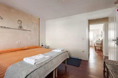 Letto o letti in una camera di GuestHost - Affaccio sul Brenta - bright apartment in Oriago