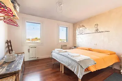 Letto o letti in una camera di GuestHost - Affaccio sul Brenta - bright apartment in Oriago