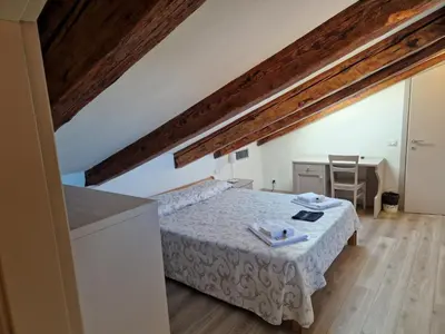 Letto o letti in una camera di Guest House Ca' dell'Angelo