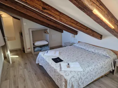 Letto o letti in una camera di Guest House Ca' dell'Angelo