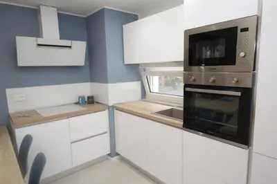 Cucina o angolo cottura di Modern and renovated flat with terrace in Rosolina