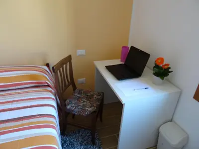 Letto o letti in una camera di B&B Giardino di Ro