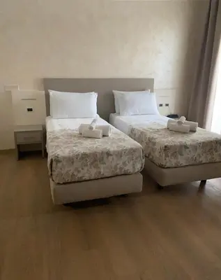 Letto o letti in una camera di Hotel Lanterna Padova