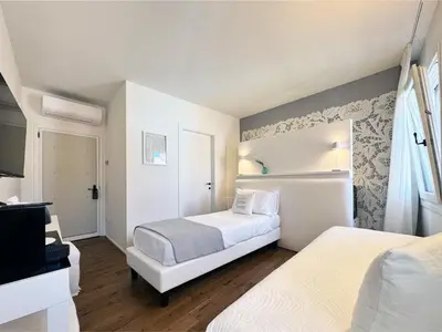 Letto o letti in una camera di B&B Carmen Garden