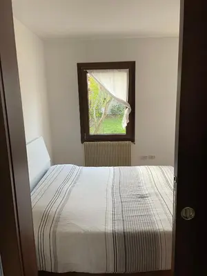 Letto o letti in una camera di Appartamento zona fiera Treviso