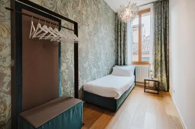 Letto o letti in una camera di Dimora Capuleti