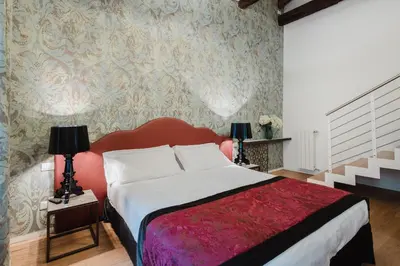 Letto o letti in una camera di Dimora Capuleti