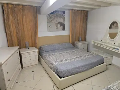 Letto o letti in una camera di I Gioielli del Doge - Ametista