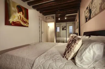 Letto o letti in una camera di I Quattro Mori by Wonderful Italy