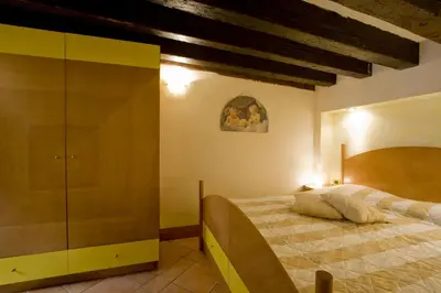 Letto o letti in una camera di I Gioielli del Doge - Topazio