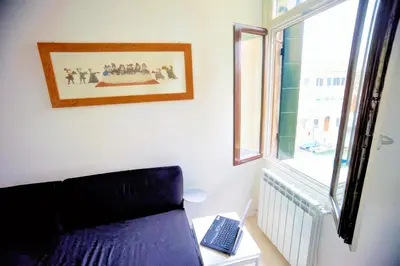 Letto o letti in una camera di Ca' Vittoria