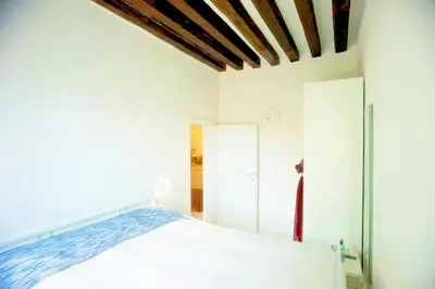 Letto o letti in una camera di Ca' Vittoria
