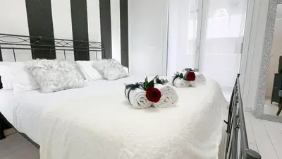 Letto o letti in una camera di Casa Helios by Ca-Sa Check