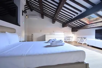 Letto o letti in una camera di Welc-ōM Padova Piazze