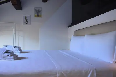 Letto o letti in una camera di Welc-ōM Padova Piazze