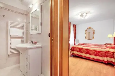 Letto o letti in una camera di Heart of Biennale